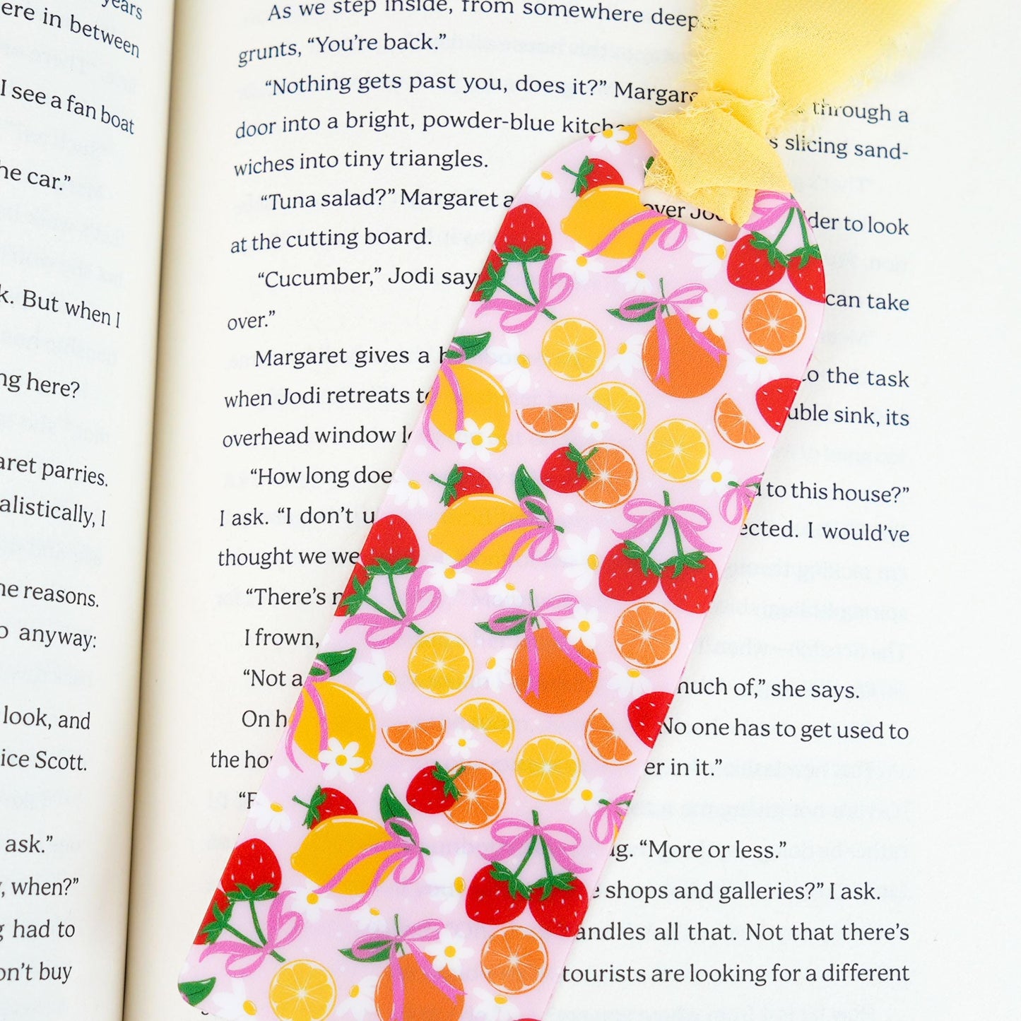 Decorative bookmark with fruit pattern on an open book