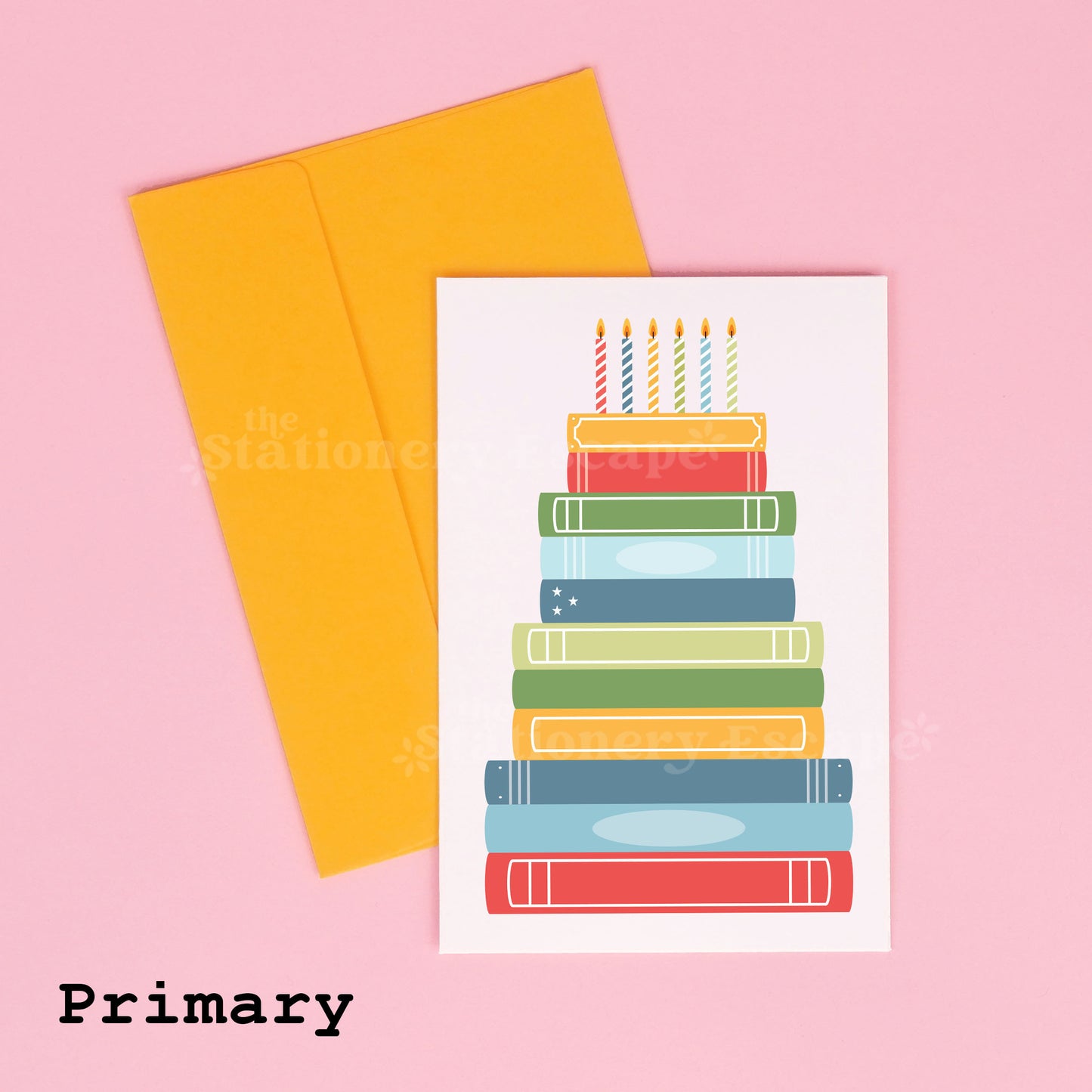 Colorful birthday card featuring a "birthday cake" made from stacked books with a yellow envelope