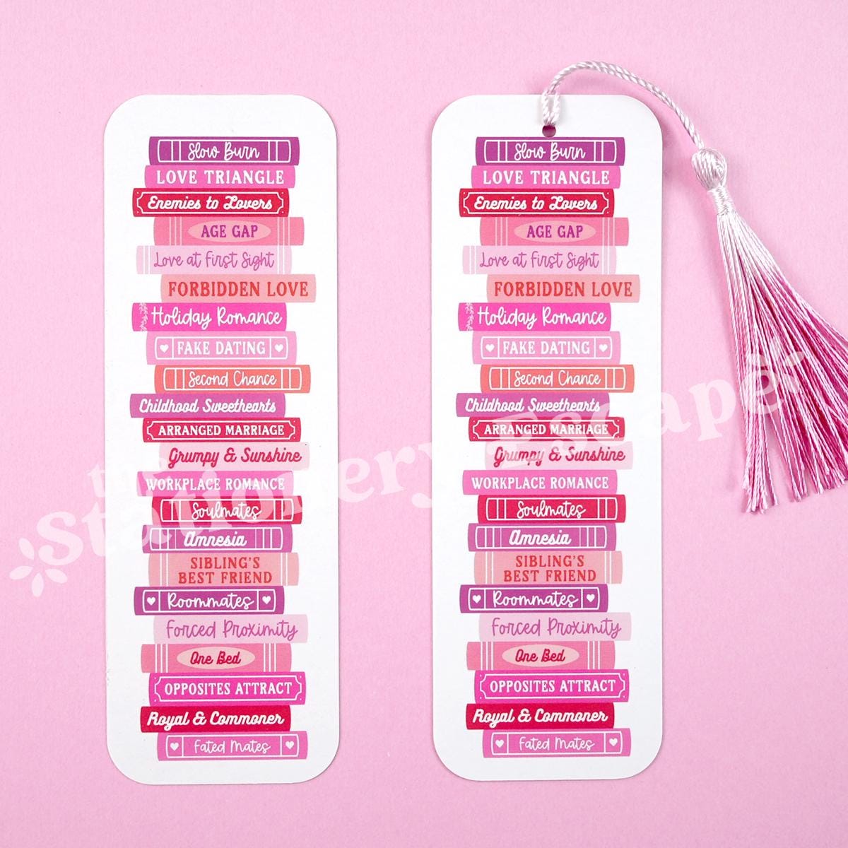 Two bookmarks with text on a pink background