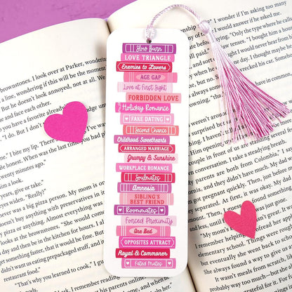 Pink bookmark with heart design on a book page