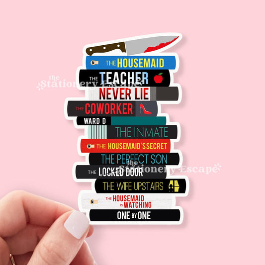 Sticker of stack of Freida McFadden books with titles on a pink background
