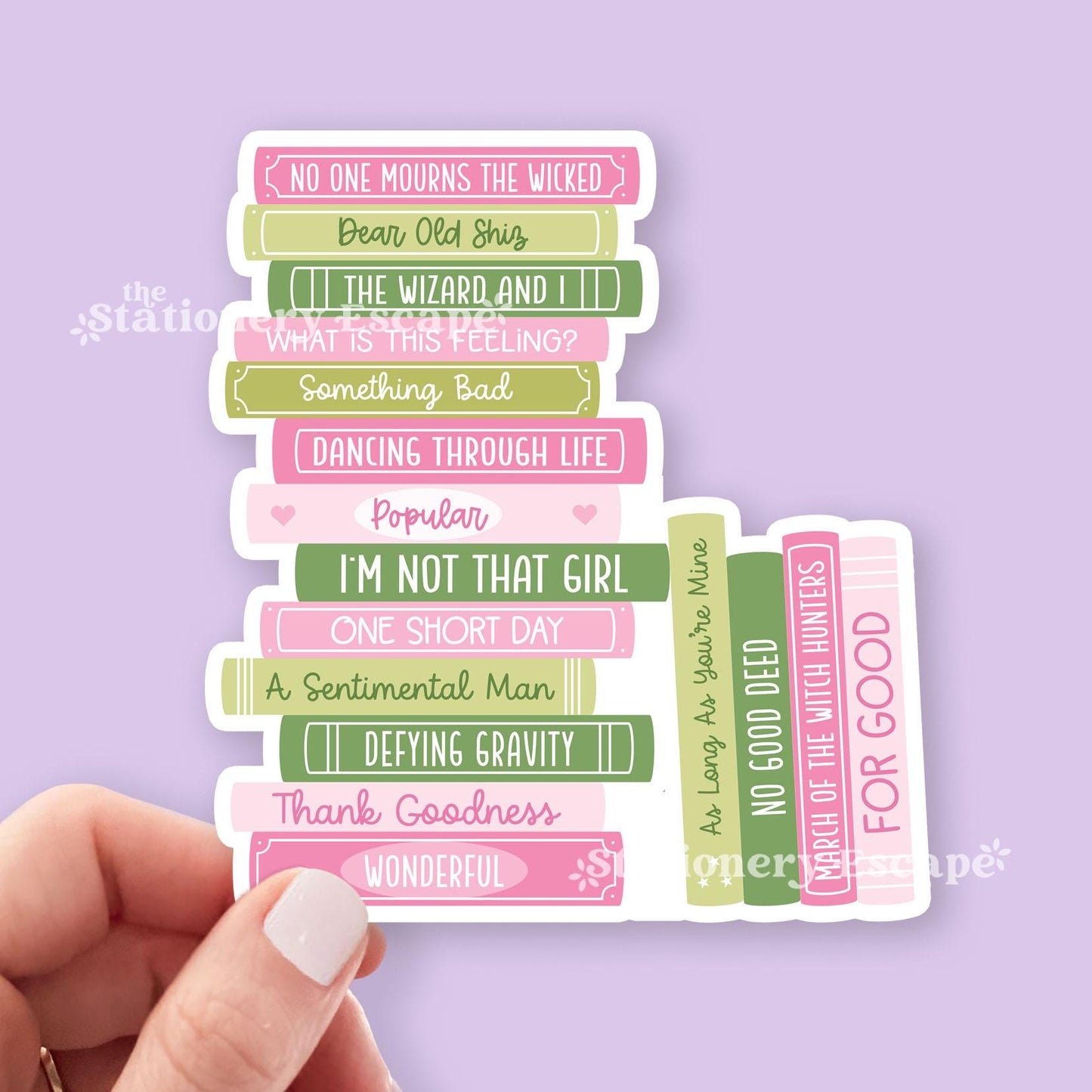 Sticker featuring stack of pink and green books with song title text held by a hand on a purple background