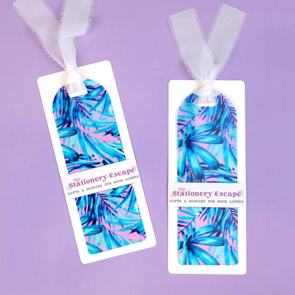 Two colorful bookmarks with a tropical leaf pattern on a purple background, branded 'The Stationery Escape'.