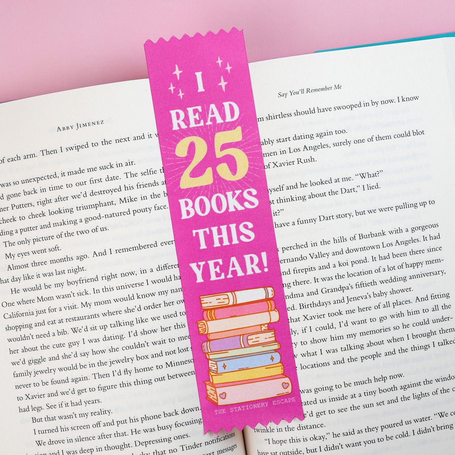 Pink bookmark with 'I Read 25 Books This Year!' text on an open book with a pink background
