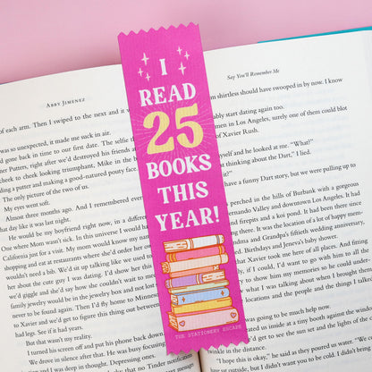 Pink bookmark with 'I Read 25 Books This Year!' text on an open book with a pink background