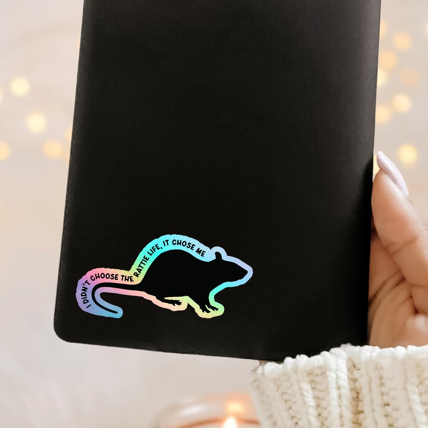 Holographic rat sticker with "I didn't choose the rattie life, it chose me" text on Kindle