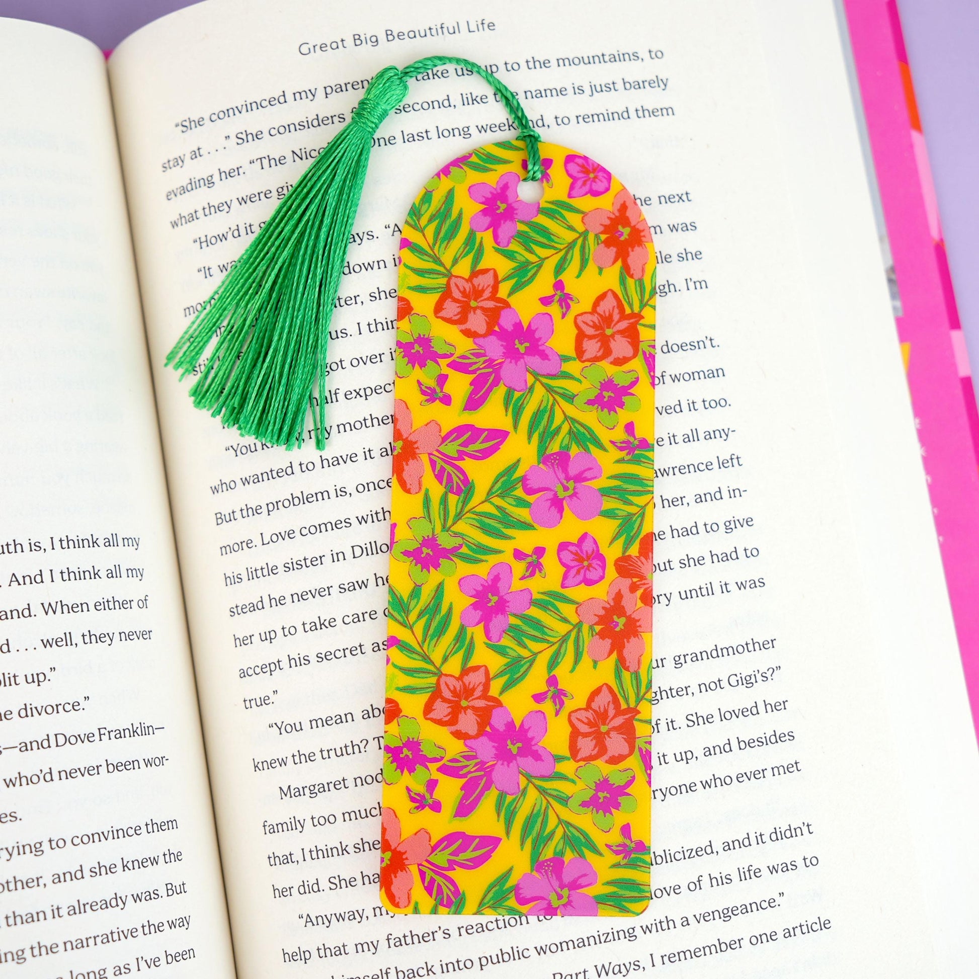 Floral bookmark with tassel on an open book