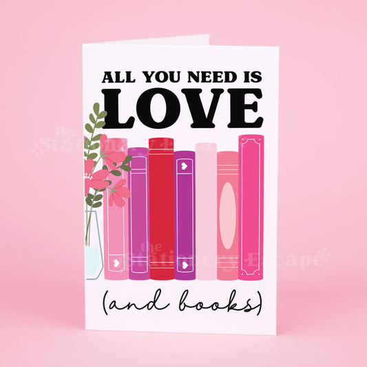 Greeting card featuring flowers and pink, red, and purple books with text "All You Need is Love (and books) on pink background