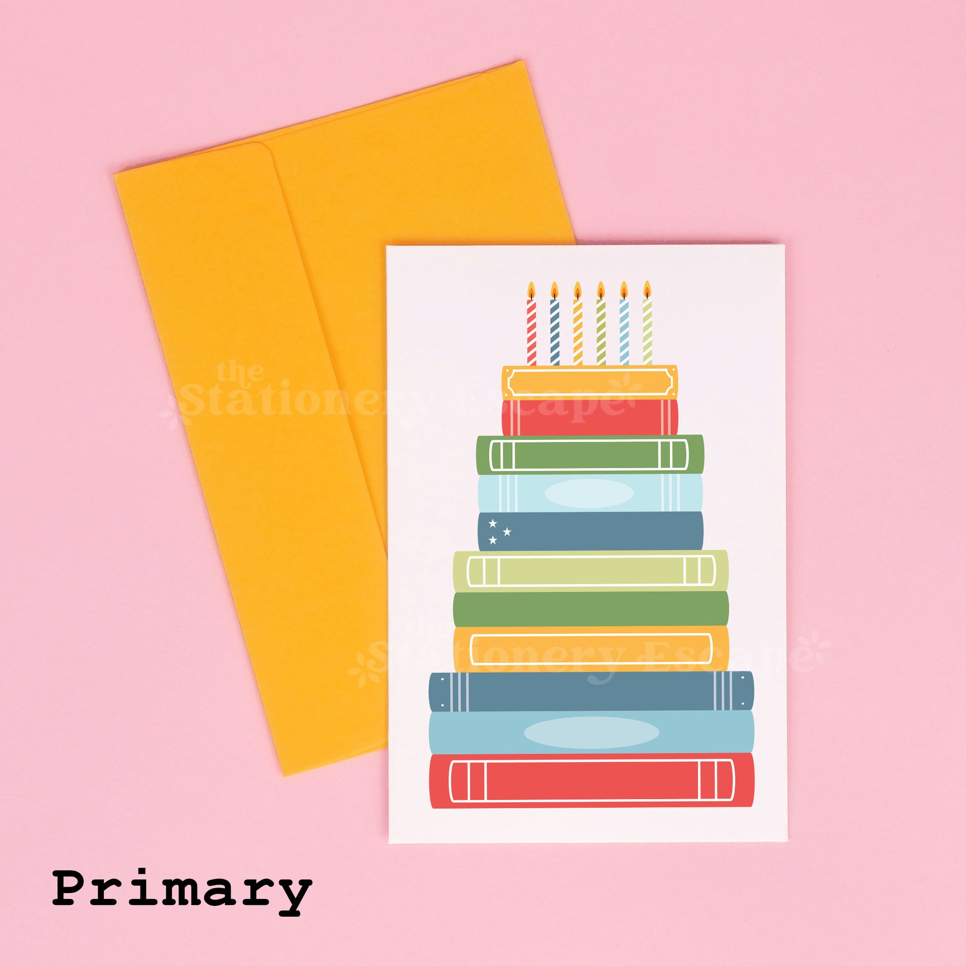 Colorful birthday card featuring a "birthday cake" made from stacked books with a yellow envelope