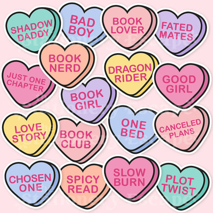 Candy heart-shaped stickers with book-themed phrases on a pink background