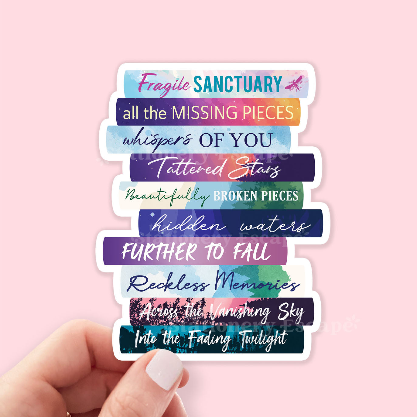 Book Stack sticker in hand featuring the works of Catherine Cowles in colorful book spines on pink background