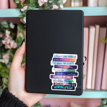 Book Stack sticker on Kindle case featuring the works of Catherine Cowles in colorful book spines with pink books in background
