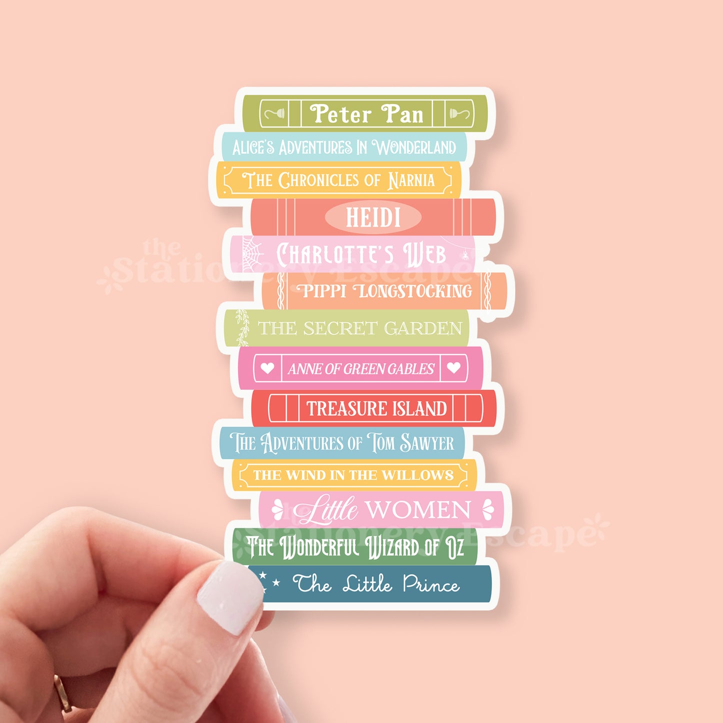 Stack of colorful book stickers with titles on a pink background