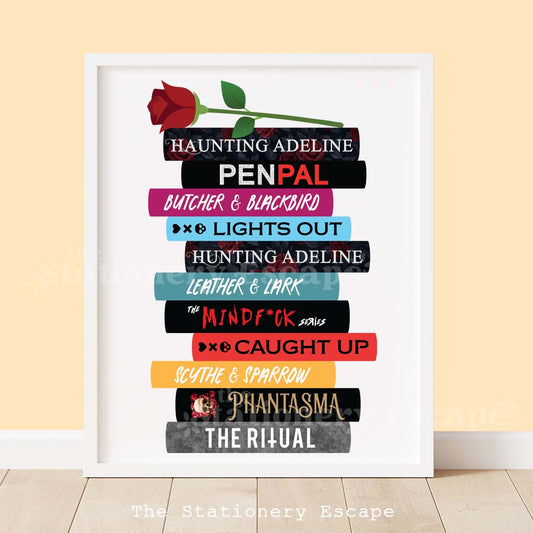 Framed book stack art print featuring the spines and titles of popular modern dark romance novels by various authors The book stack is topped by a dark red rose. 