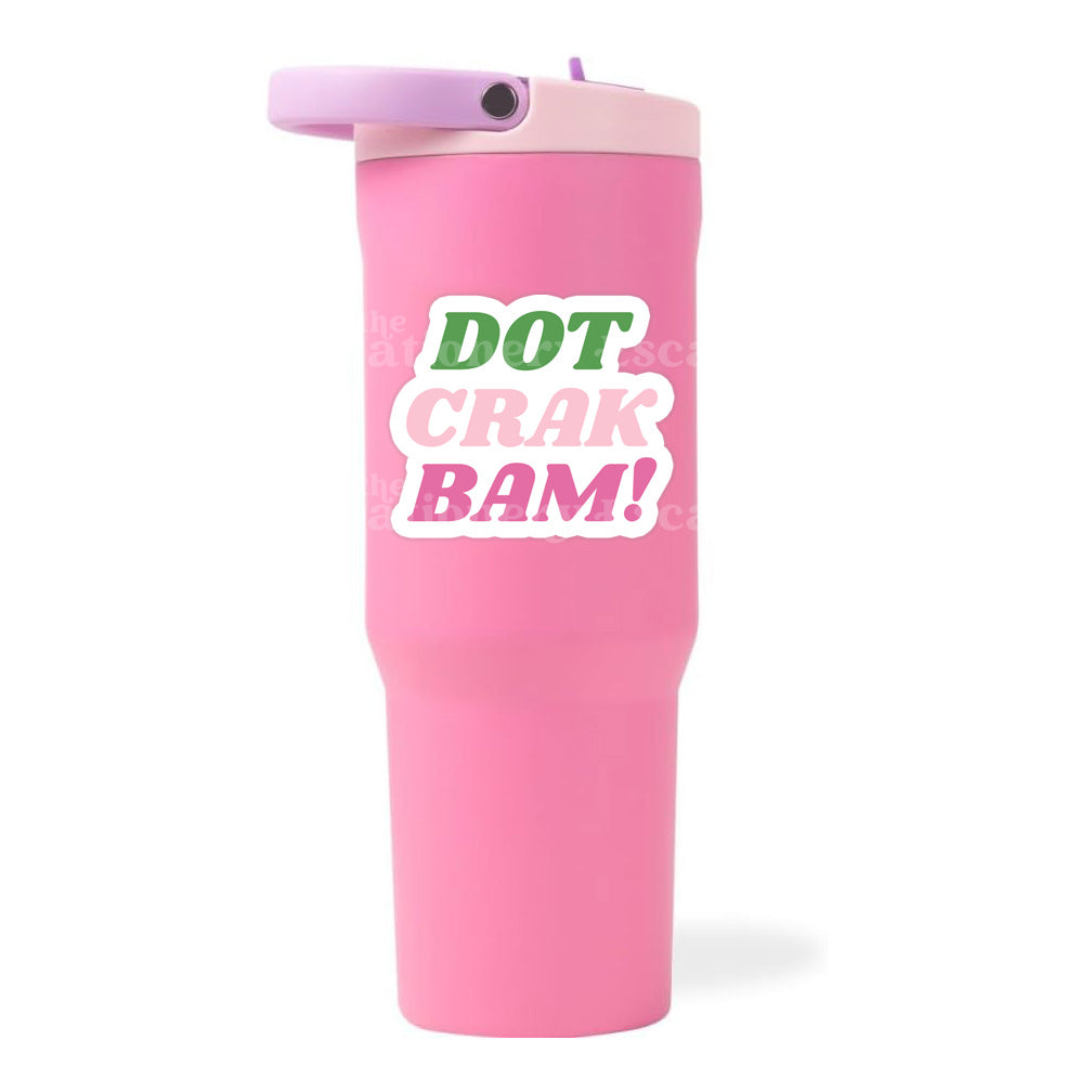 Pink tumbler with Dot Crak Bam! sticker on a white background