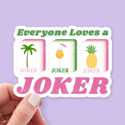 Sticker with 'Everyone Loves a Joker' text and three mahjong tiles on a purple background.