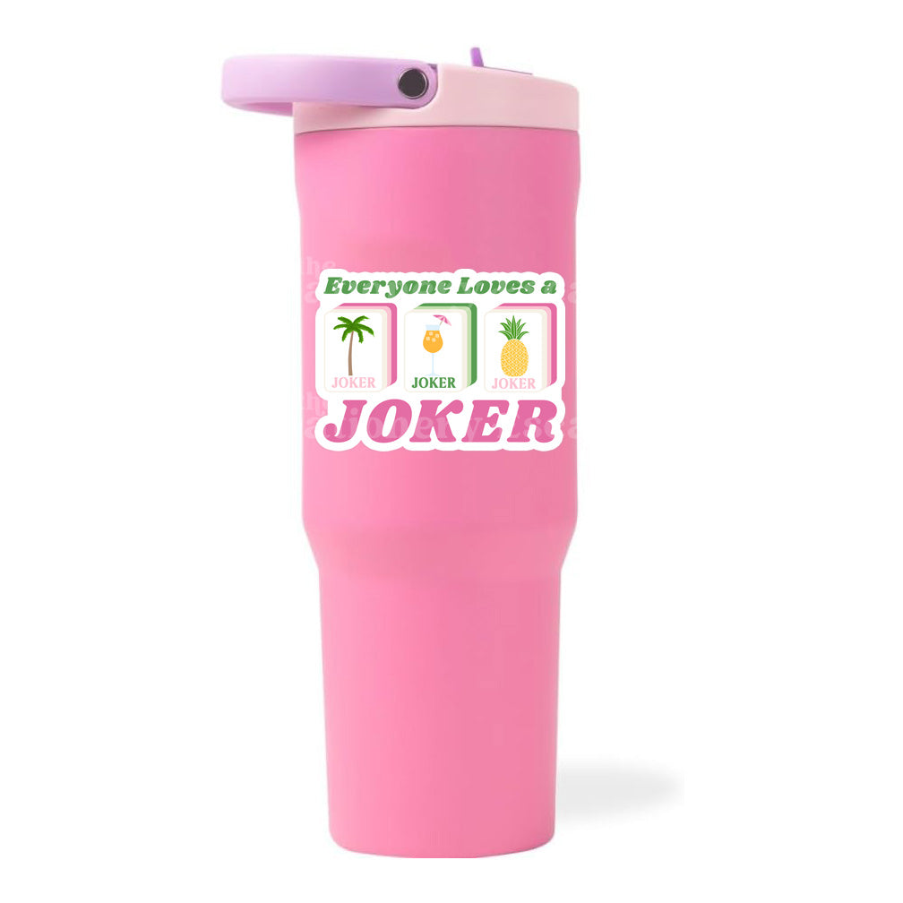 Pink tumbler with a humorous "Everyone Loves a Joker" mahjong tile design and text on a white background