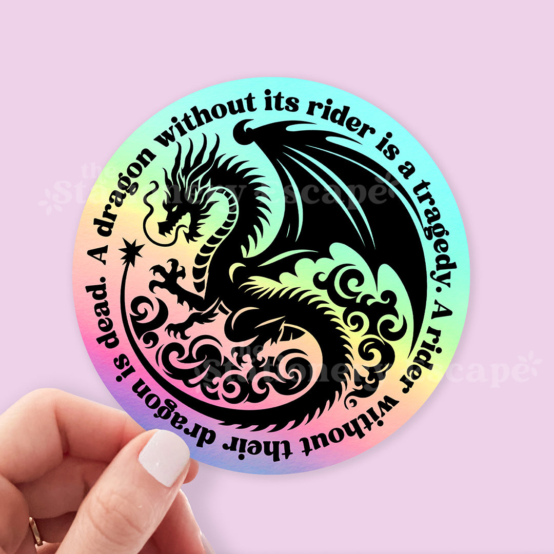 Round sticker with dragon design and text on a holographic background, held by a hand.