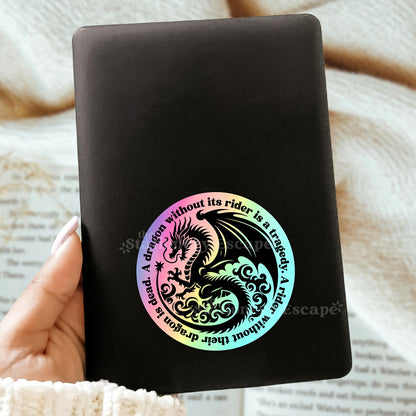Black Kindle with a holographic dragon sticker and Fourth Wing quote
