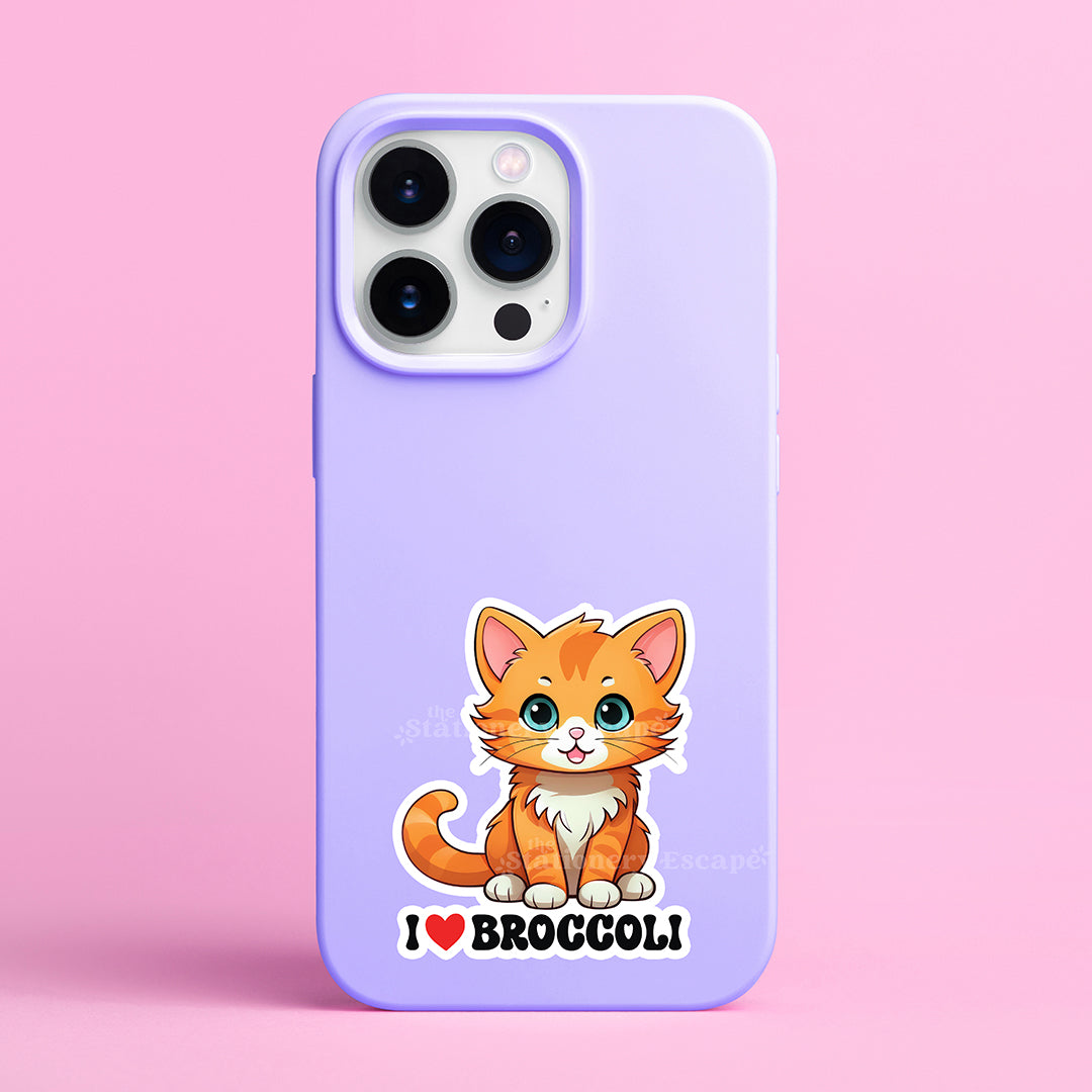 Phone case with an orange cat sticker and 'I ❤️ Broccoli' text on a pink background