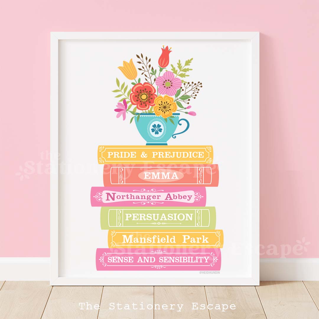 Framed book stack art print featuring the spines and titles of classic novels by Jane Austen. The book stack is topped by a wildflower-filled blue teacup.