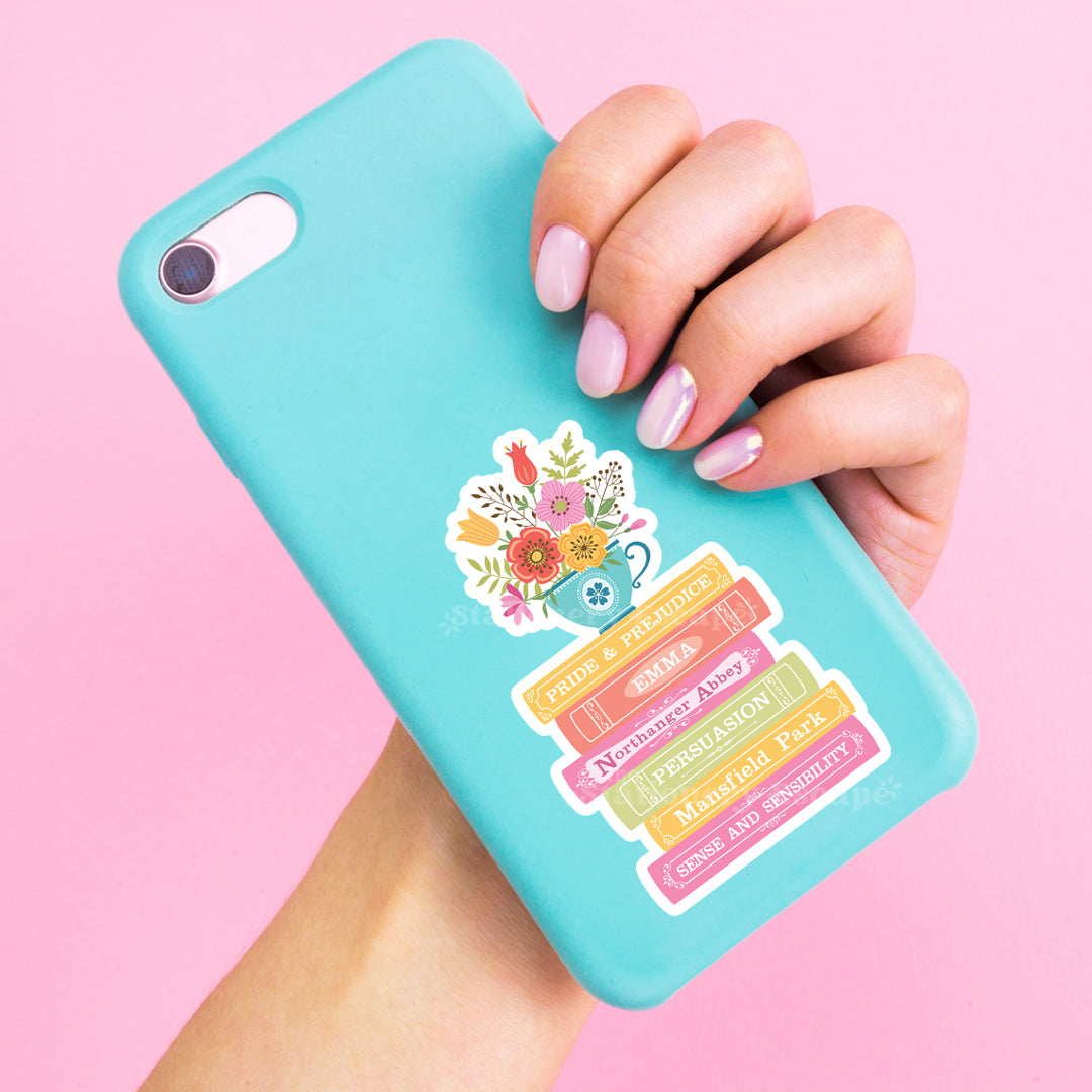 Turquoise phone case with colorful Jane Austen book stack sticker held by a hand on a pink background