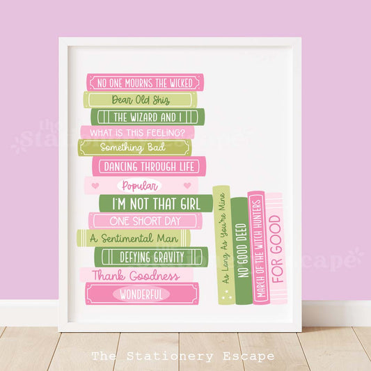 Framed colorful book stack art print featuring a book stack in shades of pink and green with titles reflecting songs from the popular witch musical. 