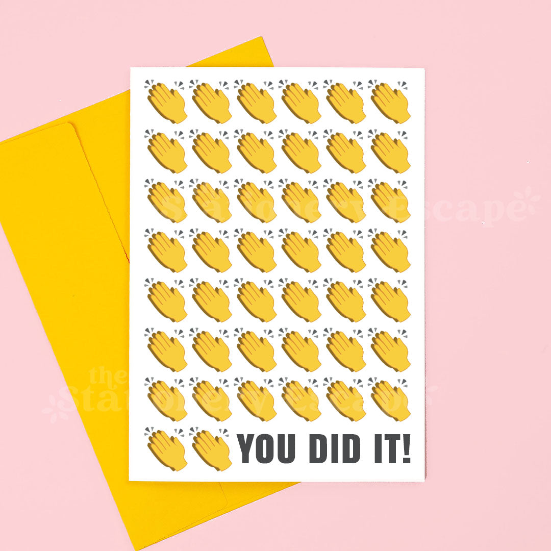 Greeting card with yellow hand illustrations and 'YOU DID IT!' text on a pink background