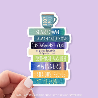 Sticker of a stack of Fredrik Backman book titles and a coffee cup on a purple background