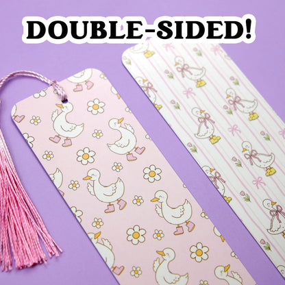 Double-sided pink bookmark with goose pattern on a purple background