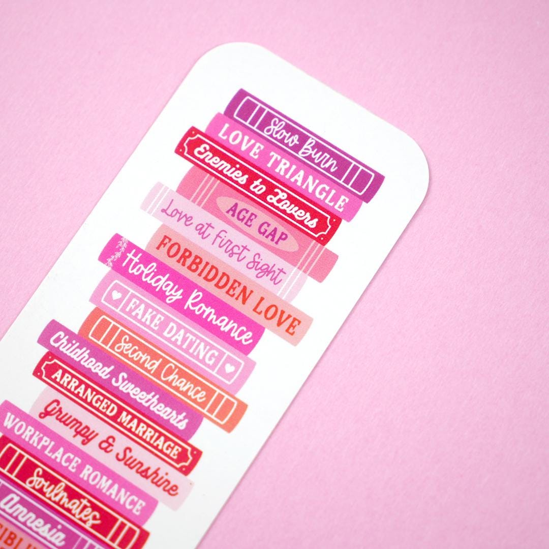 Romance genre tropes bookmark on a pink background