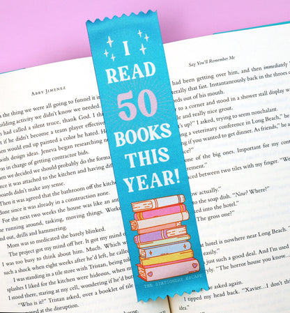 Bookmark with 'I Read 50 Books This Year!' text on a book page
