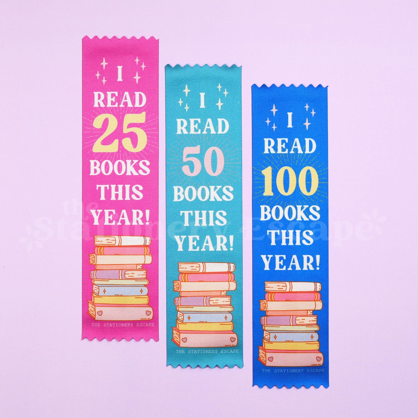 Three colorful bookmarks indicating reading achievements on a light purple background