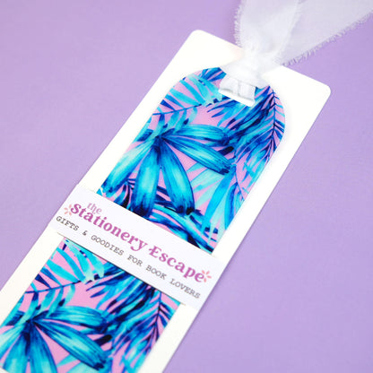 Bookmark with blue leaf design on a purple background