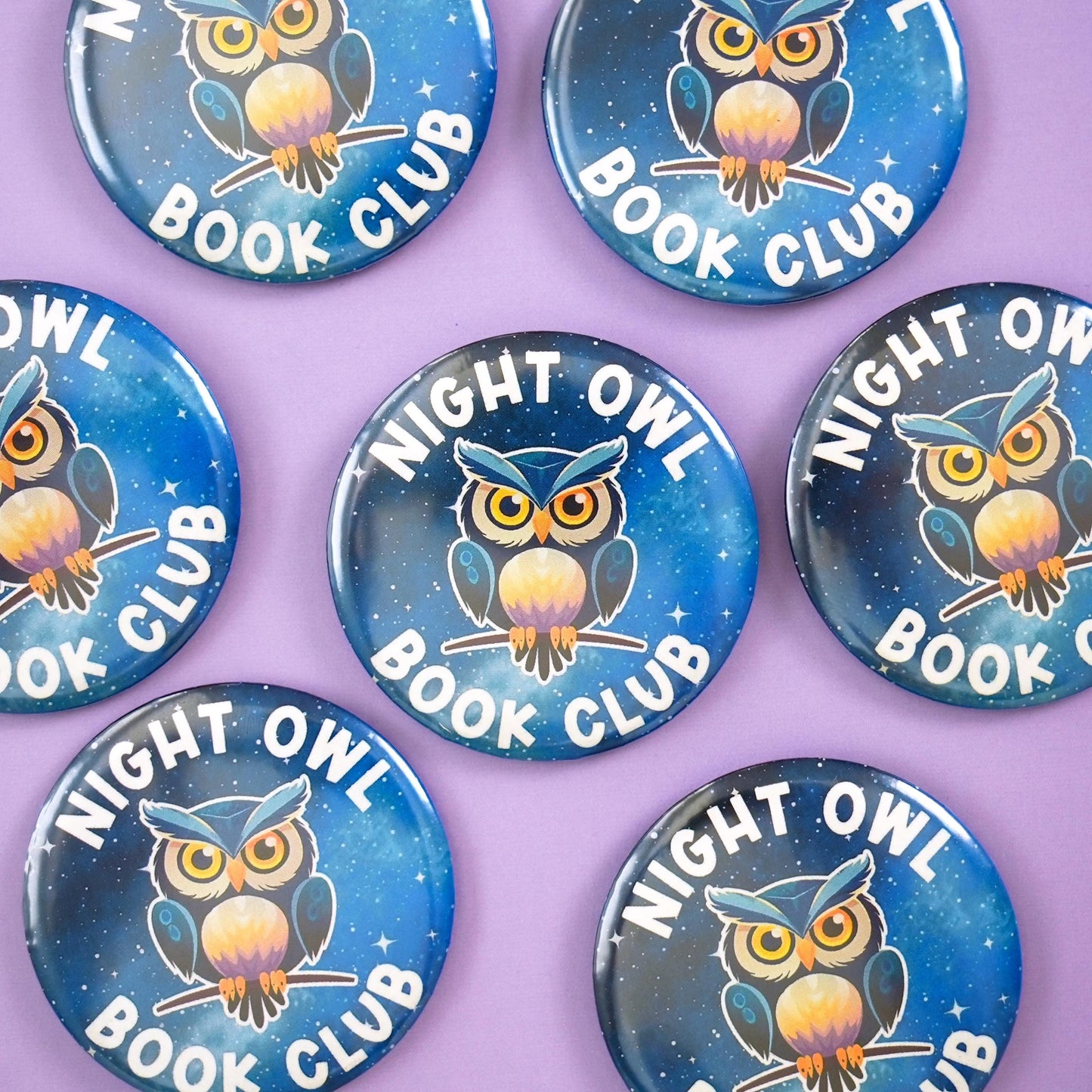 Buttons with owl design and 'Night Owl Book Club' text on a purple background
